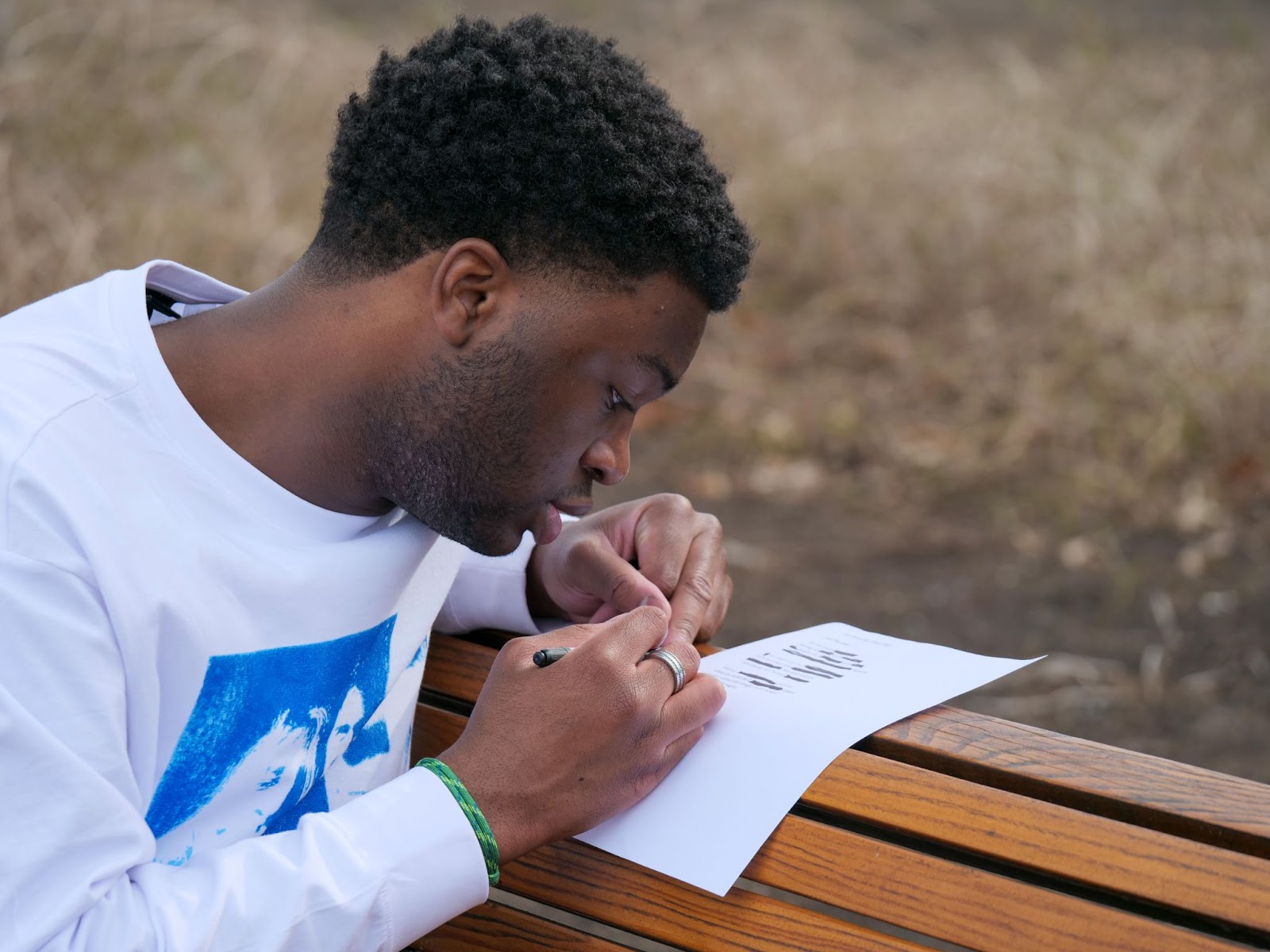 Finalist Bem Denga works on his blackout poem.