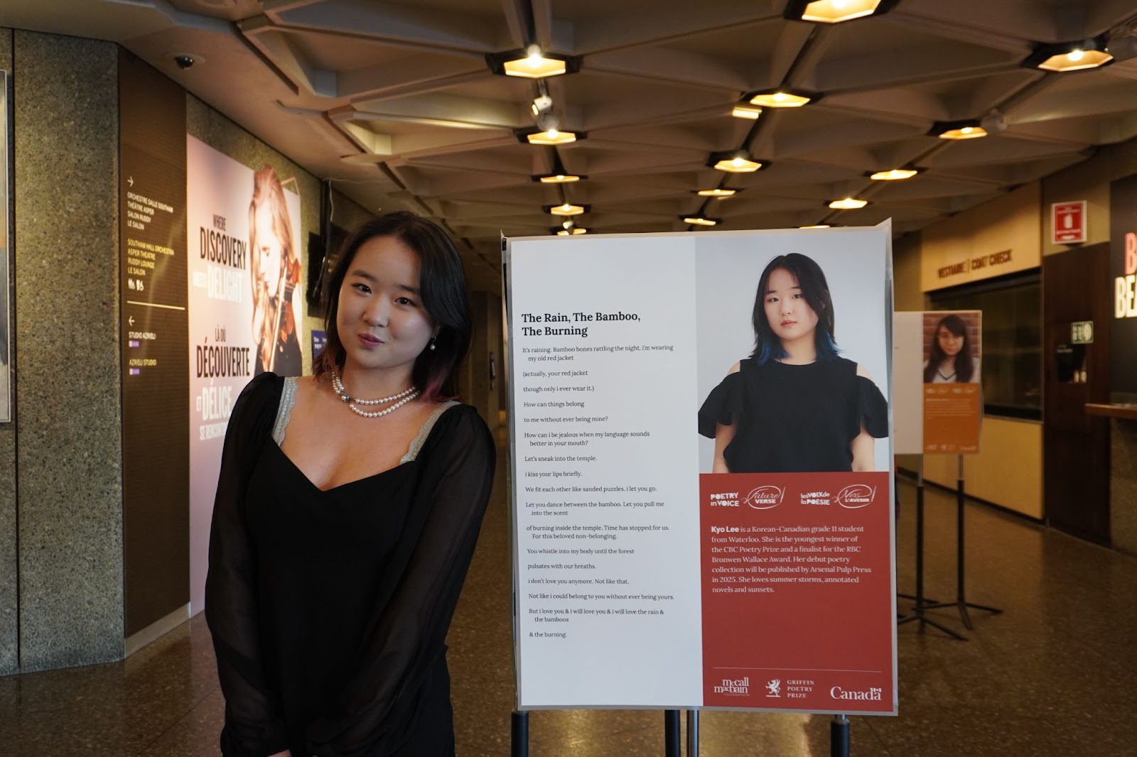Kyo stands with the poem that got her accepted for FutureVerse 2024.