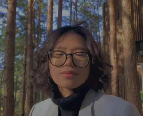 Young woman standing in the forest