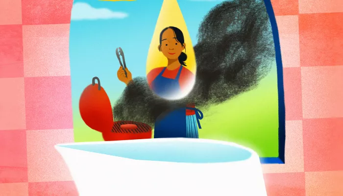 Un pichet de limonade et une mère devant un bbq