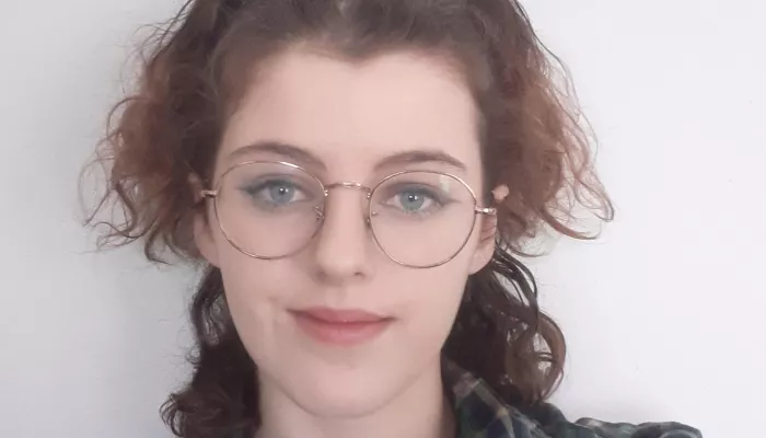 a young person looks at the camera