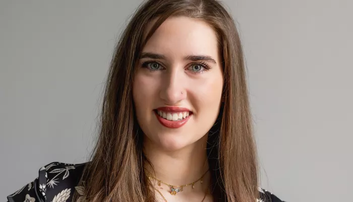 A young woman looks at the camera