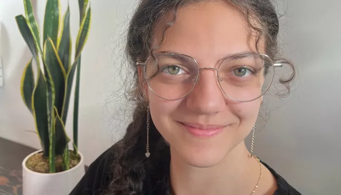 A young woman looks at the camera
