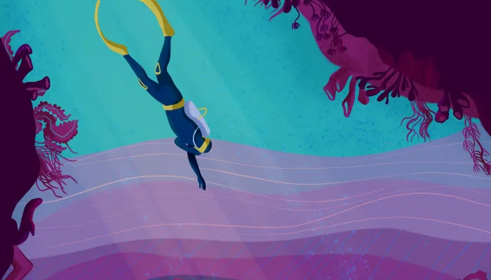 Scuba diver swims toward ocean floor.