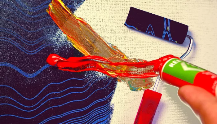 a painter squeezes paint out
