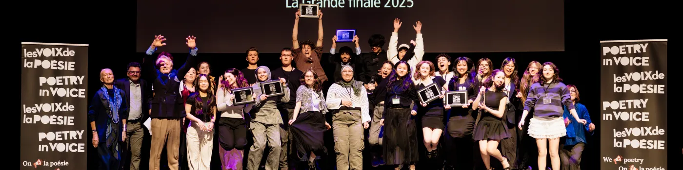 Students jumping on a stage