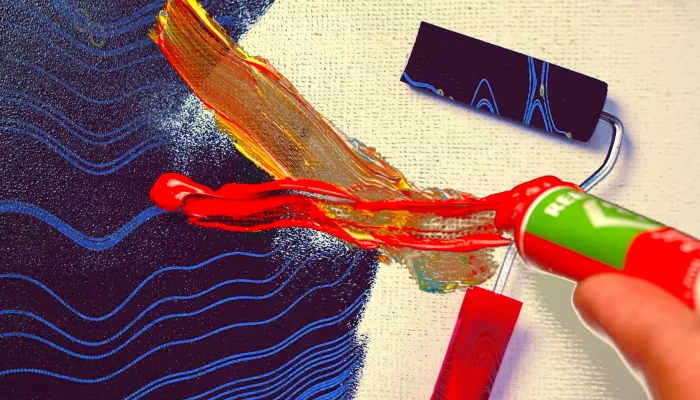a painter squeezes paint out