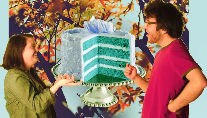 Two people with a layered cake over an autumn scene